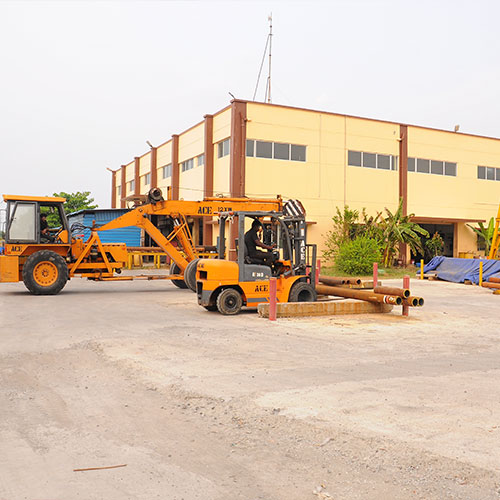 Heavy duty work vehicles parked at the side of Apex Industries
